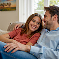 © muravev | freepik.com | Young couple relaxing on comfortable couch in bright living room enjoying...